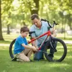 AZUR-Mini-Bike-Pump-–-Lightweight-Hand-Pump-Presta-Schrader-Boy-and-Father-pumping-tyre.webp