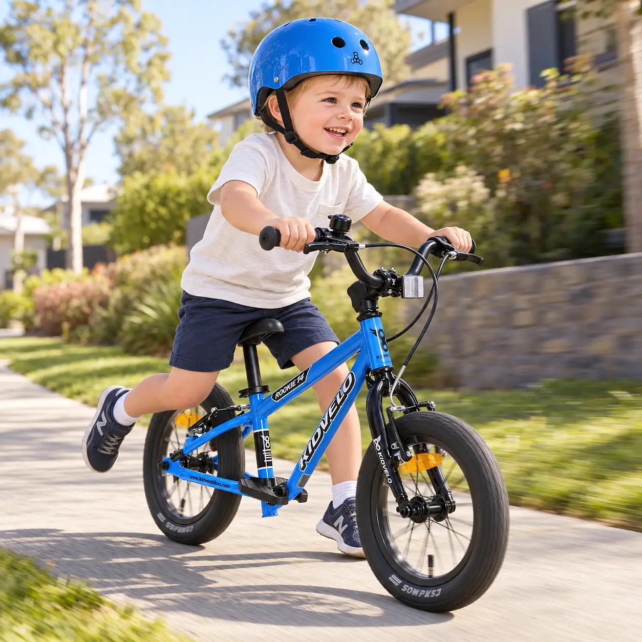Child Riding A Blue Kidvelo Rookie 14 Balance Bike In A Park